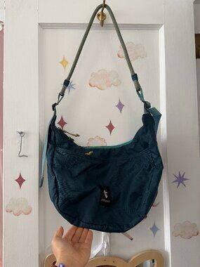 Cotopaxi crossbody bag in blue adjustable strap
